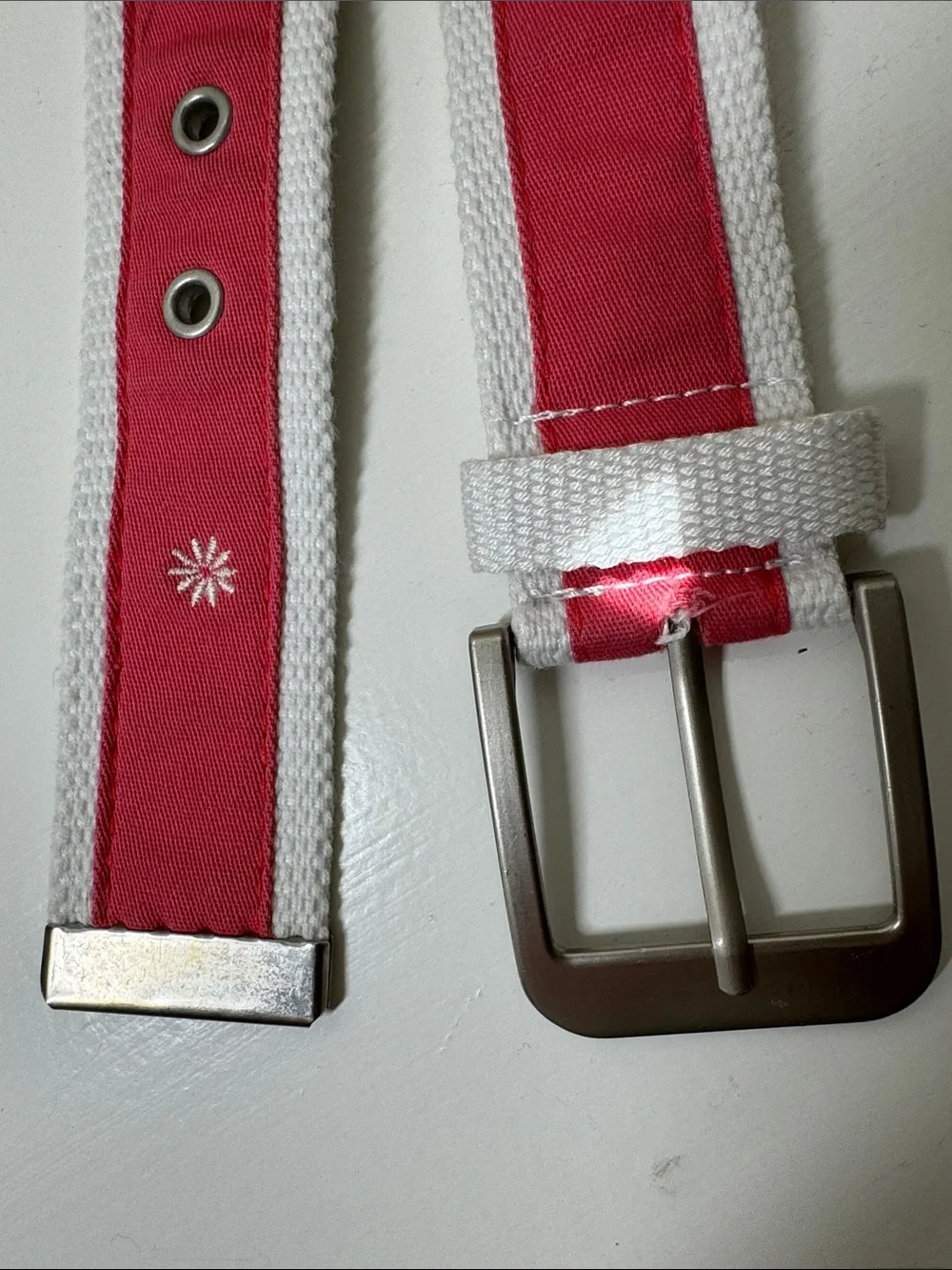 Unbranded coal and white ribboned web belt with silver tone buckle.